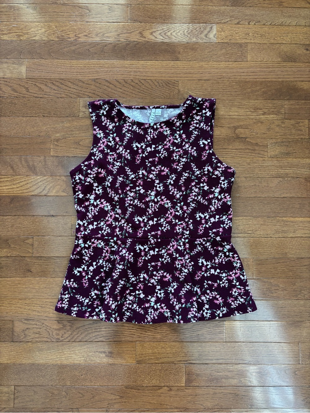 Elle Burgundy Sleeveless Peplum Blouse with Floral Print